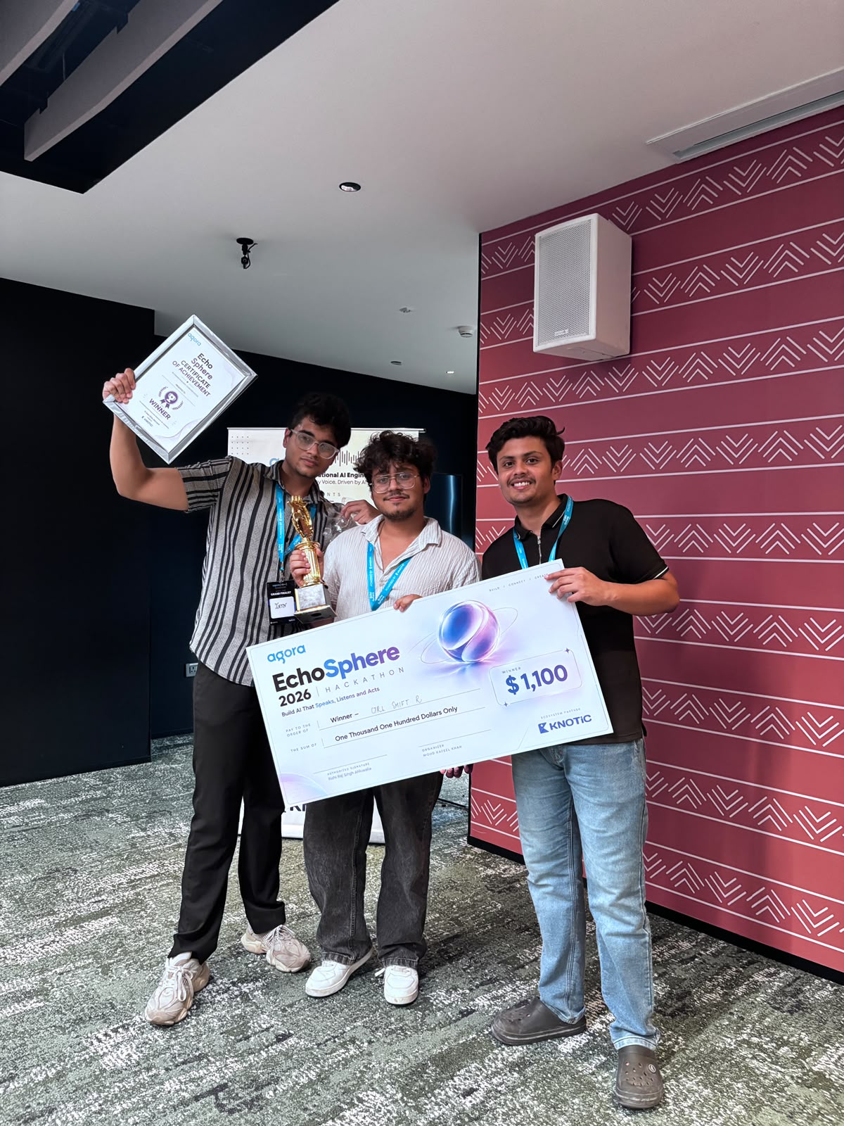 Team CodeHackers celebrating their Agora Ecosphere 2026 win with the trophy and winner cheque